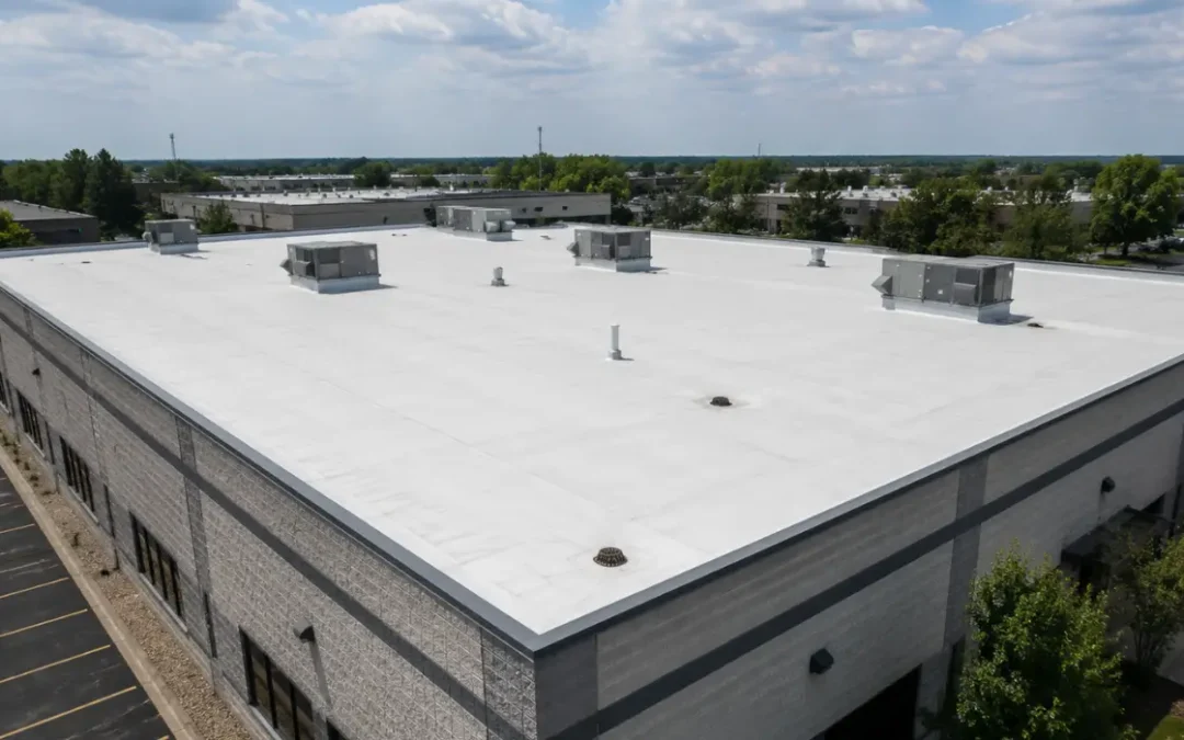 TPO roofing covers a commercial building with white membrane, HVAC units, drains, vents, and visible seams.